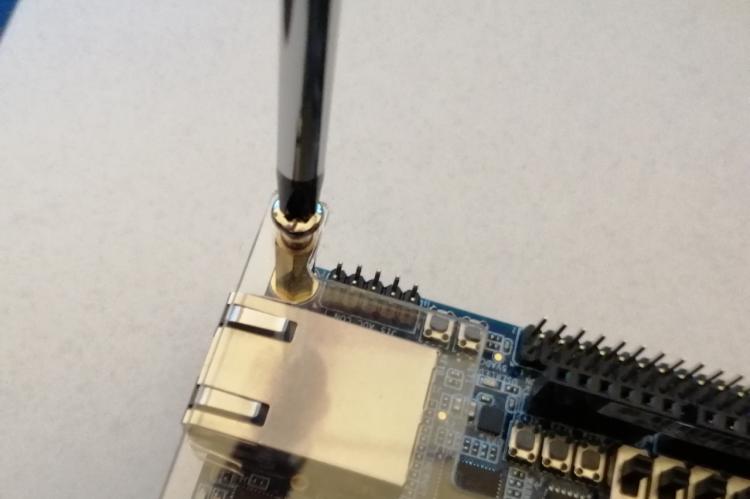 Unscrew DE10-nano plexiglass plate